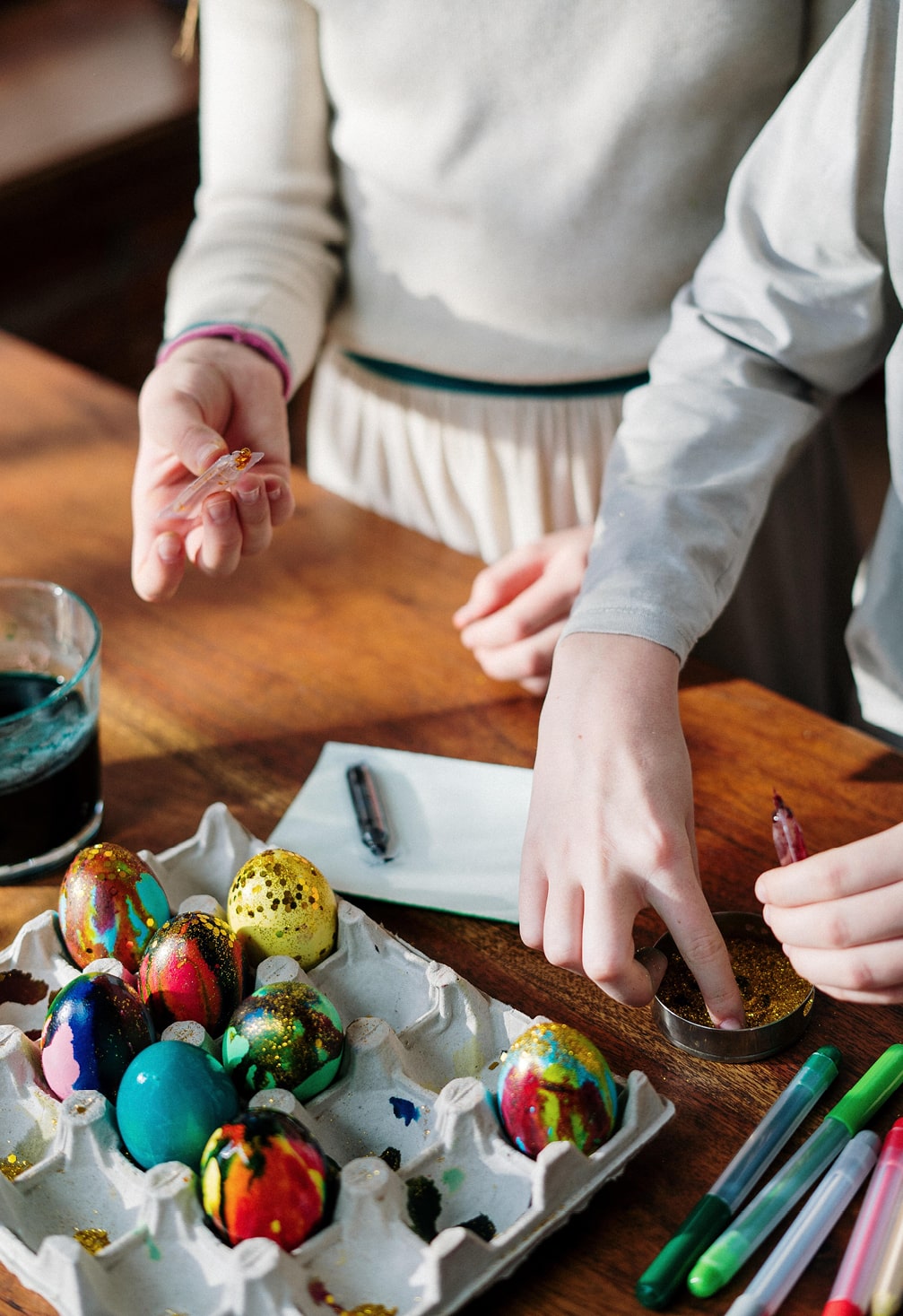 Child doing craft with eggs